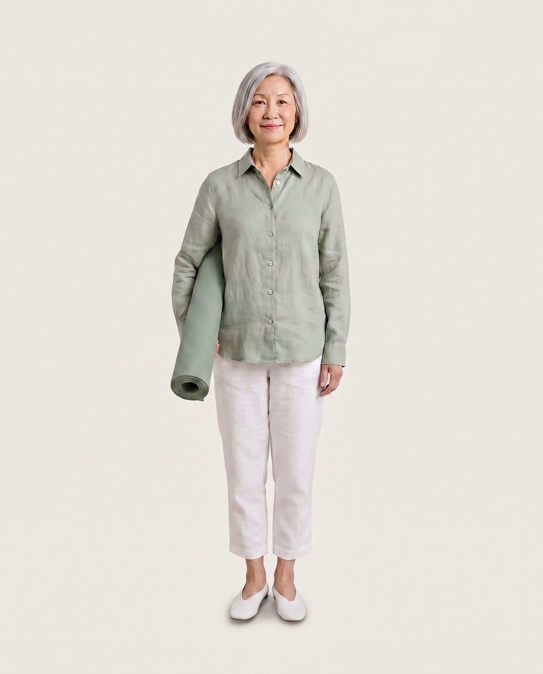 Woman in her sixties in a sage shirt