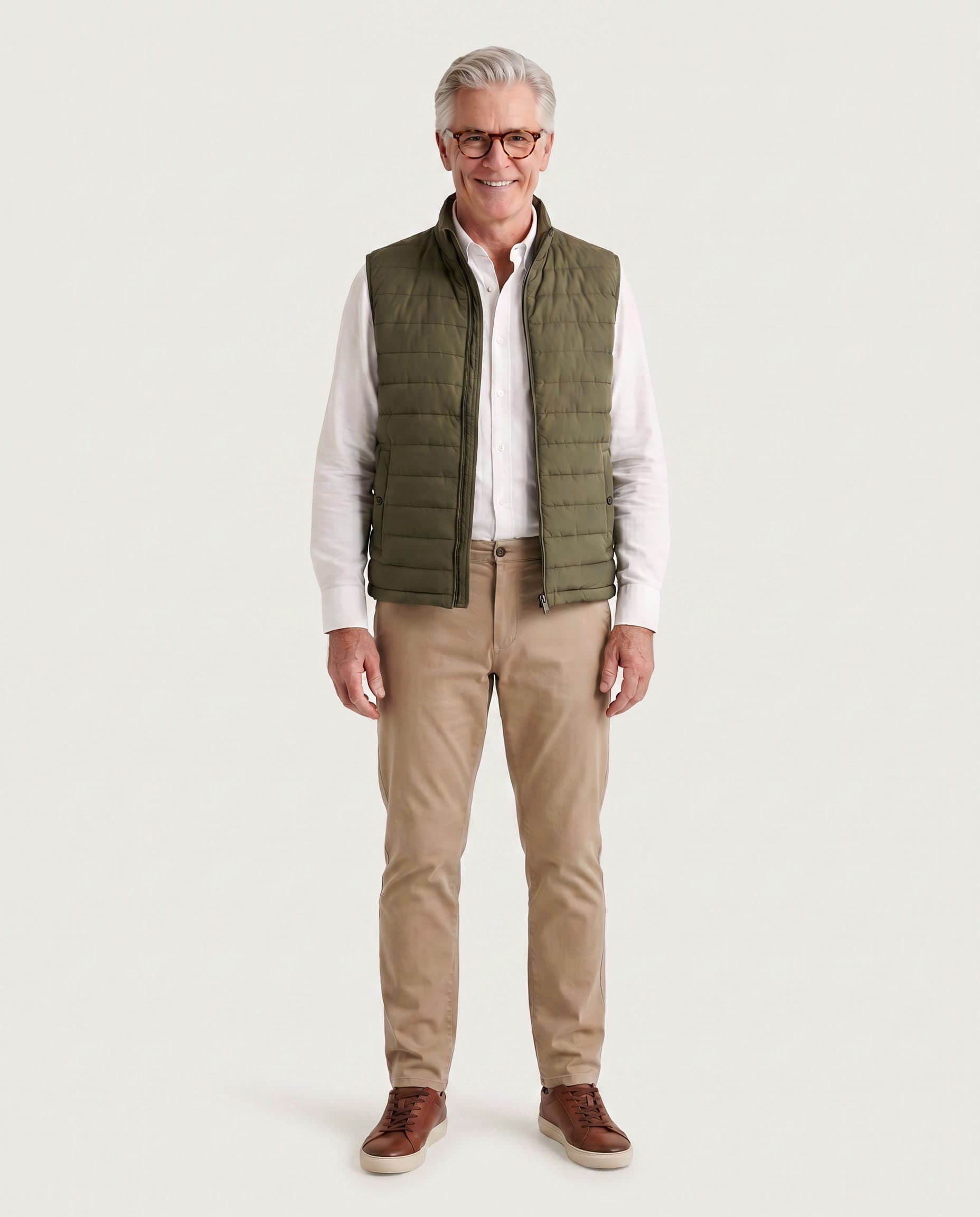 Man in his sixties in an olive vest